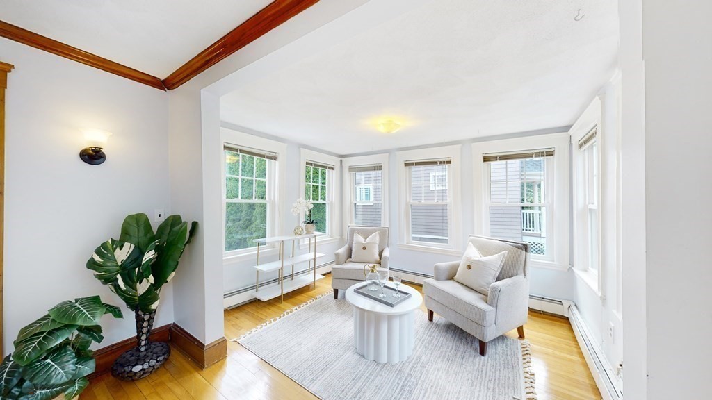 82 Roberts Road Medford, MA 02155 - Photo 4 of 30 a living room with furniture and a potted plant