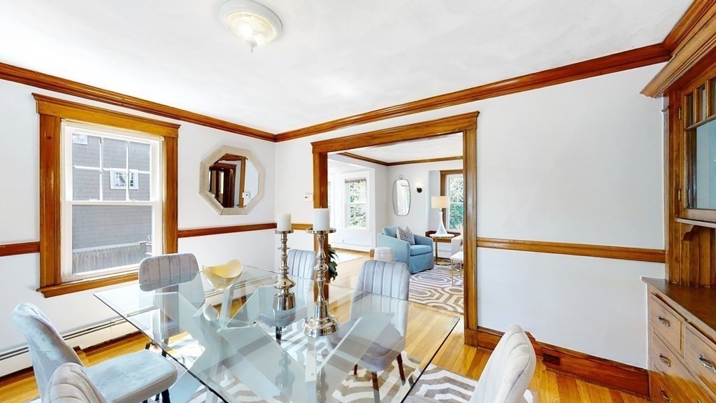82 Roberts Road Medford, MA 02155 - Photo 5 of 30 a living room with furniture and a floor to ceiling window