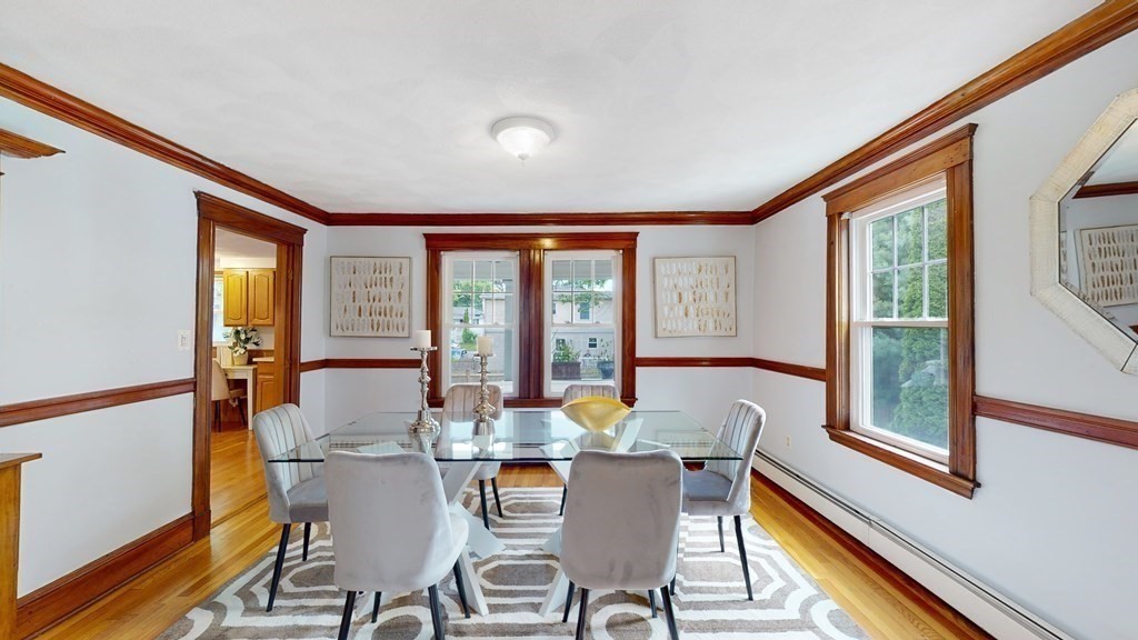 82 Roberts Road Medford, MA 02155 - Photo 6 of 30 a dining room with furniture and large windows