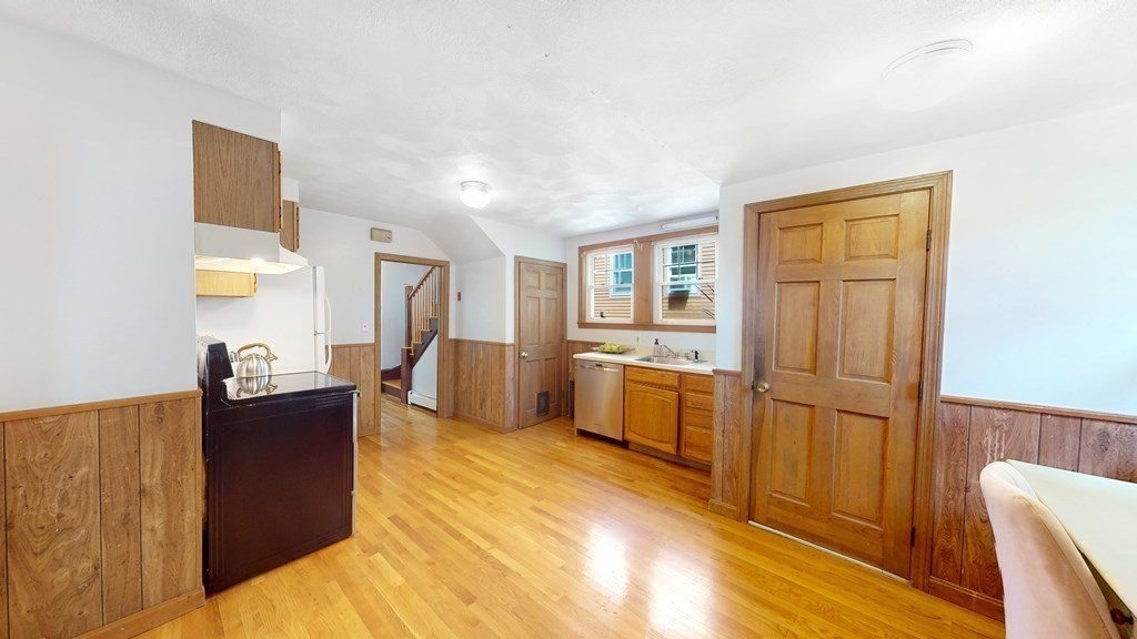 82 Roberts Road Medford, MA 02155 - Photo 7 of 30 a living room with furniture and a flat screen tv