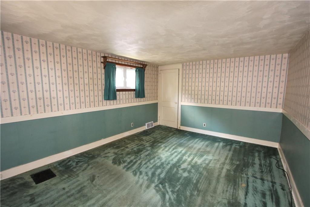 453 Simpson Howell Road Elizabeth, PA 15037 - Photo 7 of 25 16x12 Master BR has Carpeting, Two Windows, Painted Wooden Chair Rail, & Deep Closet w/Atttic Access.