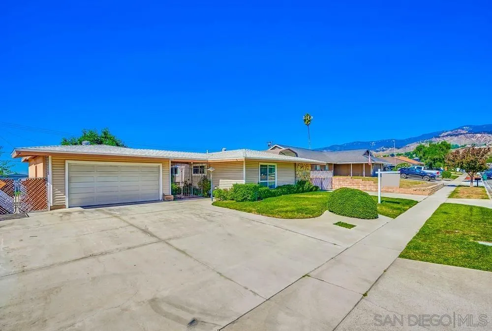 5970 Eucalyptus Drive Highland, CA 92346 - Photo 3 of 26 a front view of a house with a yard