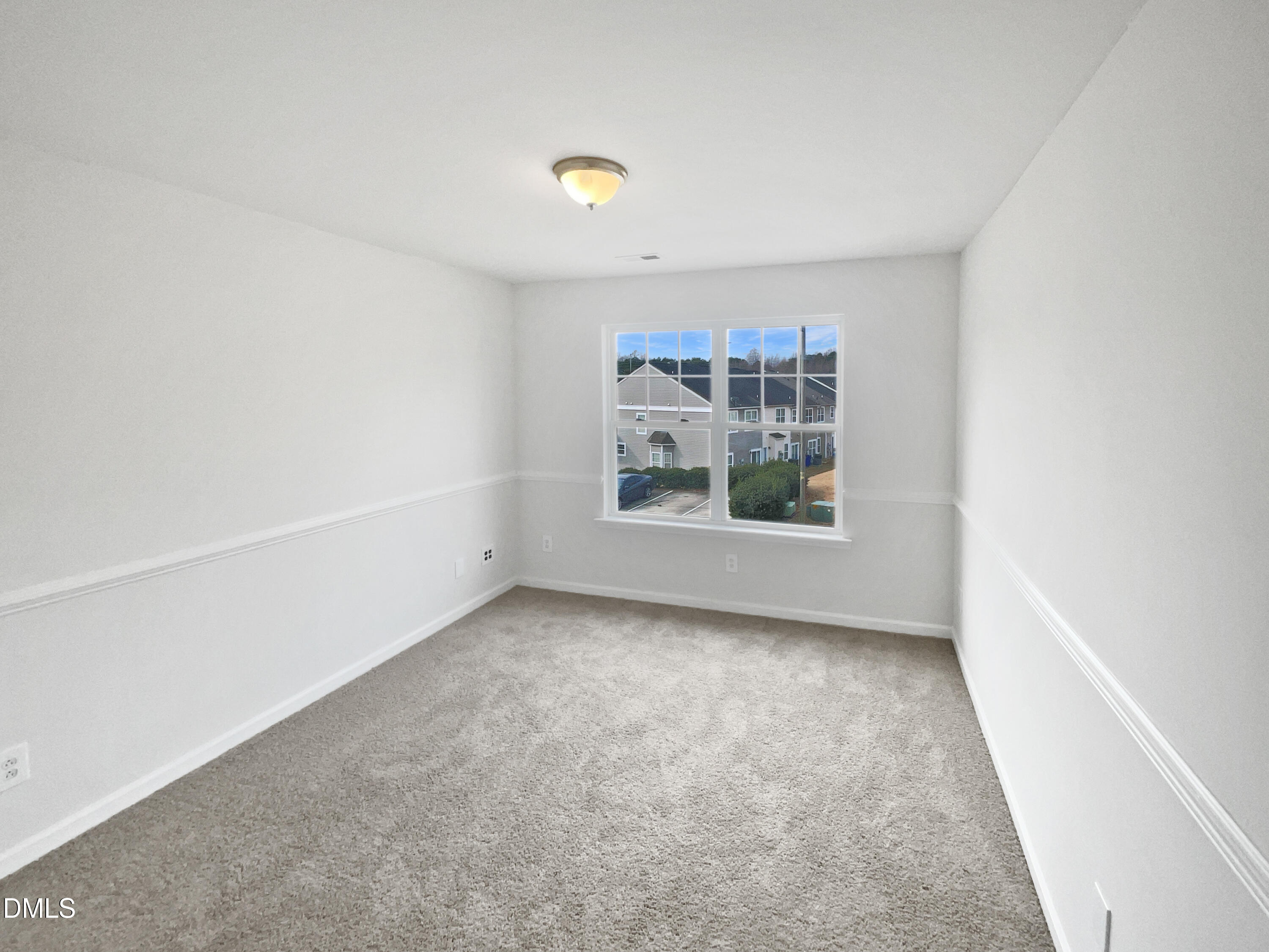 1301 Stone Manor Drive Raleigh, NC 27610 - Photo 12 of 16 a view of an empty room with a window