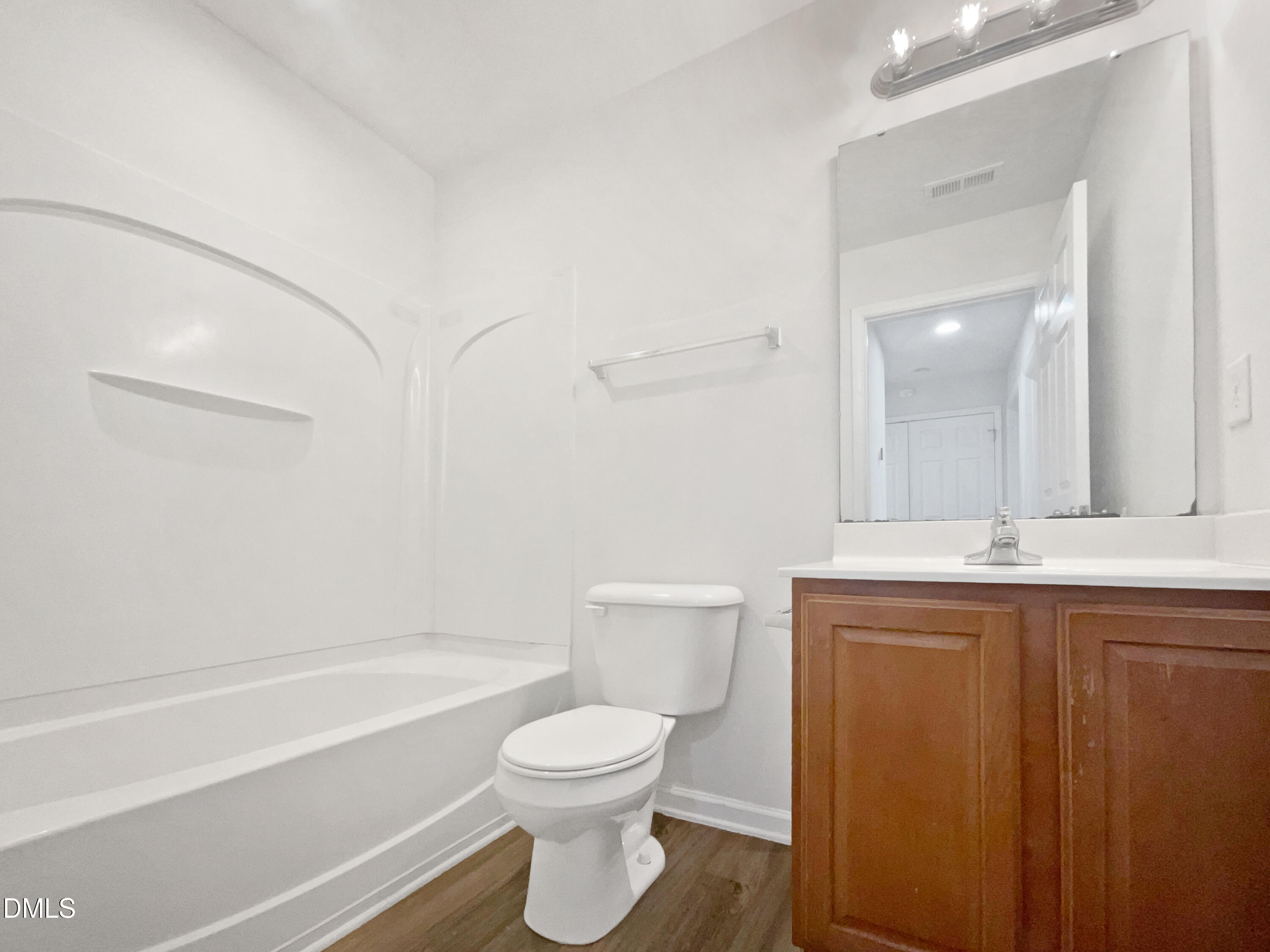 1301 Stone Manor Drive Raleigh, NC 27610 - Photo 13 of 16 a bathroom with a toilet a sink and bathtub