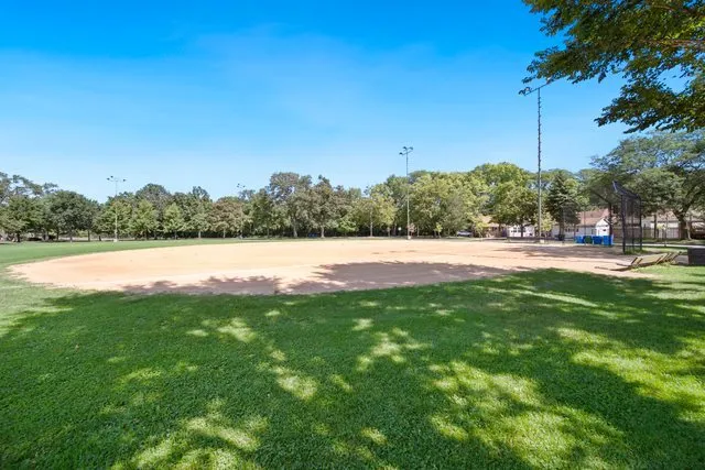 a view of a swimming pool and a yard