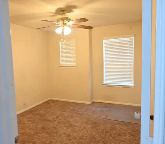 a view of a room with a fan