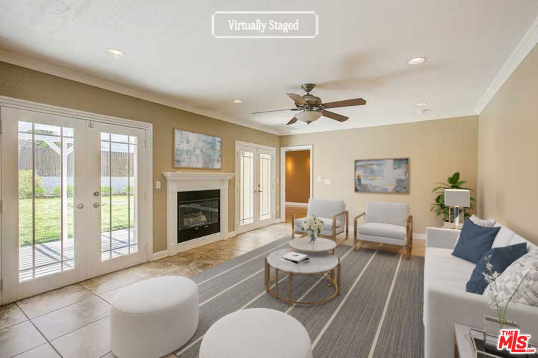 11038 Rhodesia Avenue Sunland, CA 91040 - Photo 2 of 36 a living room with furniture and a fireplace