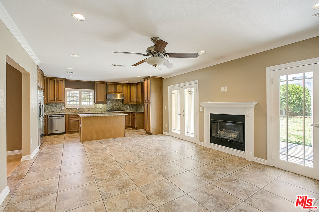 11038 Rhodesia Avenue Sunland, CA 91040 - Photo 21 of 36 a view of a kitchen with a sink and a fireplace