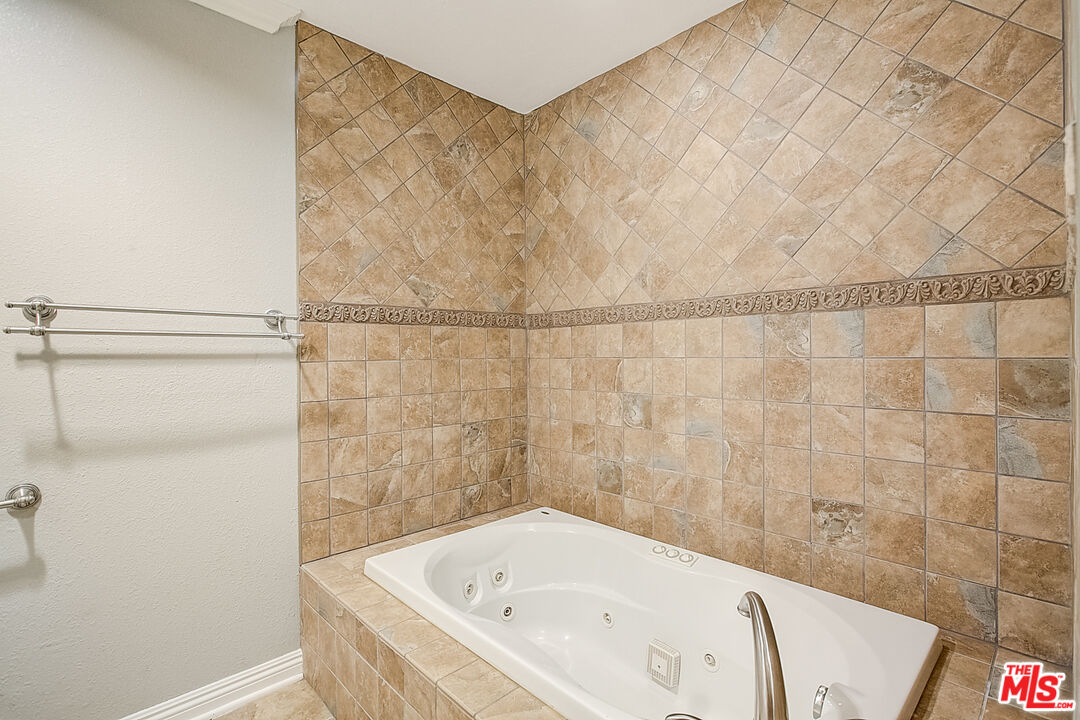 11038 Rhodesia Avenue Sunland, CA 91040 - Photo 27 of 36 a bathroom with a bathtub