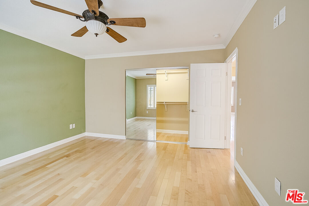 11038 Rhodesia Avenue Sunland, CA 91040 - Photo 29 of 36 wooden floor in an empty room with a window