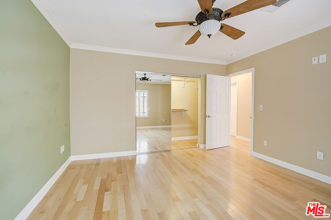 11038 Rhodesia Avenue Sunland, CA 91040 - Photo 30 of 36 a view of empty room with wooden floor and fan