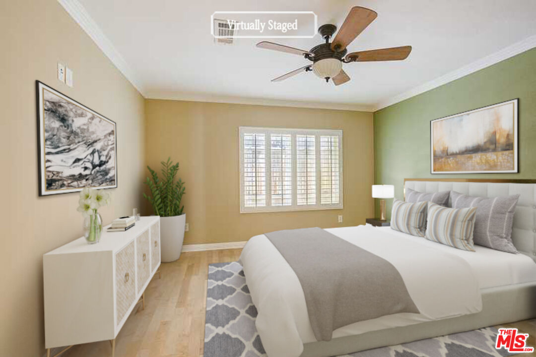 11038 Rhodesia Avenue Sunland, CA 91040 - Photo 3 of 36 a bedroom with a bed and a painting on the wall