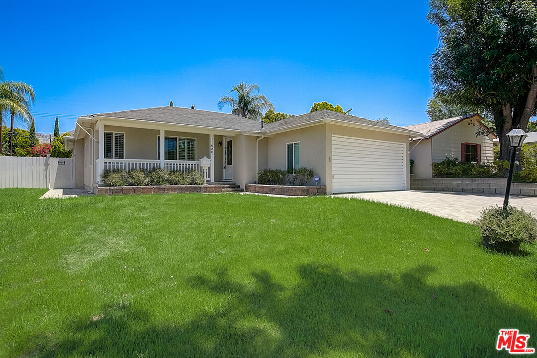 11038 Rhodesia Avenue Sunland, CA 91040 - Photo 33 of 36 a front view of house with yard and green space
