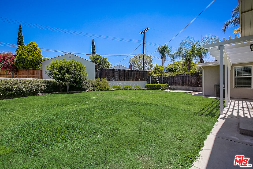 11038 Rhodesia Avenue Sunland, CA 91040 - Photo 34 of 36 a view of a garden with a house