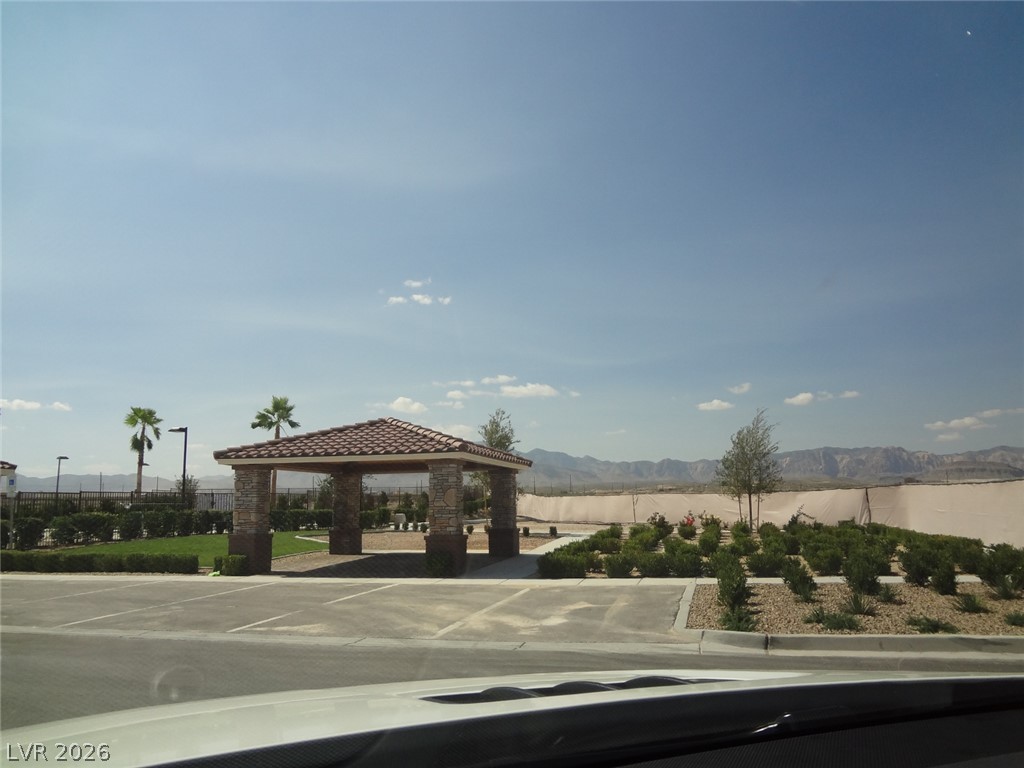 9453 Alma Ridge Avenue Las Vegas, NV 89178 - Photo 24 of 25 A well-maintained community space, featuring a tiled-roof gazebo with stone pillars.