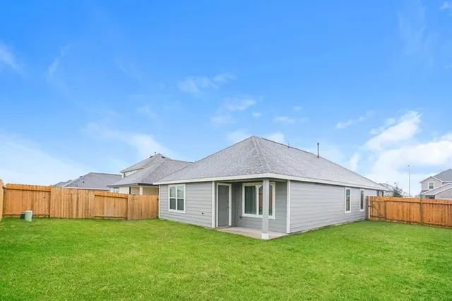 a front view of a house with yard and porch