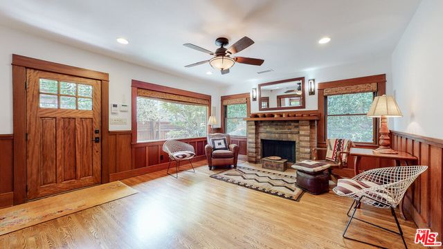 a view of backyard with outdoor seating and trees