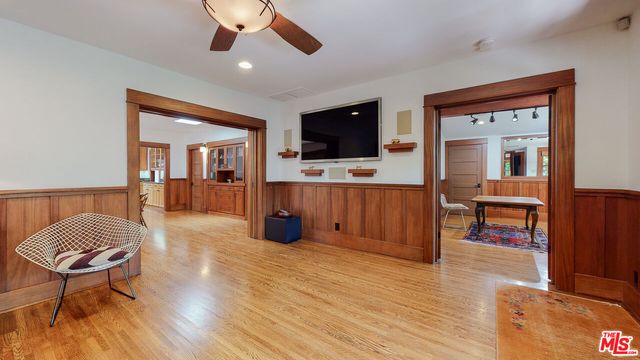 a kitchen with stainless steel appliances granite countertop a sink and a large window