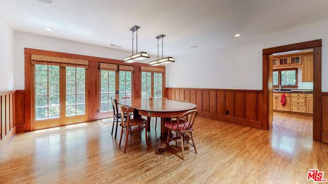 a kitchen with stainless steel appliances granite countertop a stove refrigerator and cabinets