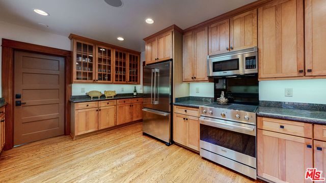 a bedroom with a large bed and a large window