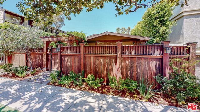 a bedroom with a large bed and a large window