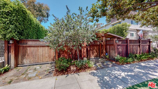 a large bathroom with a tub sink and mirror