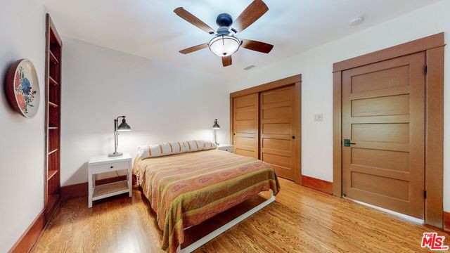 a view of backyard with deck and seating space