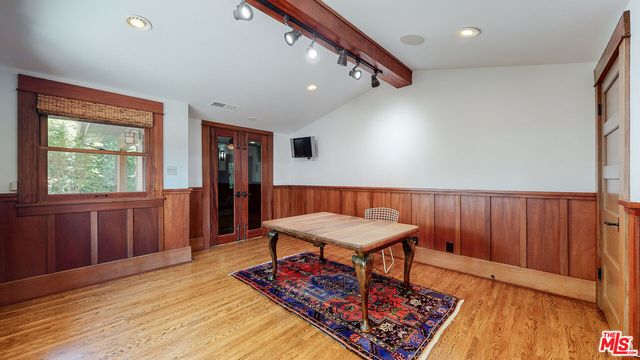 a view of a room with furniture and a window