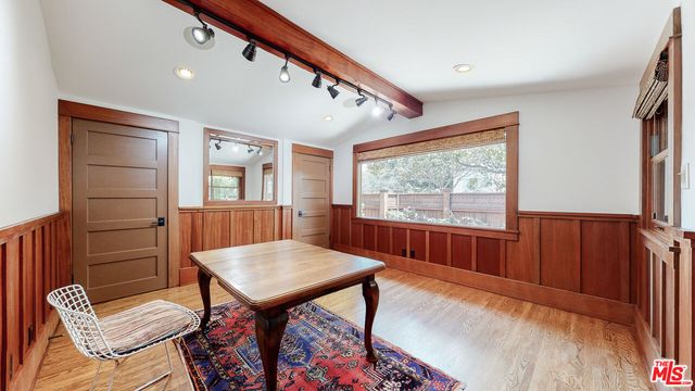 a view of a dining room with furniture window and wooden floor