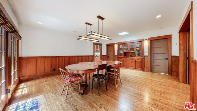 a living room with furniture fireplace and a large window