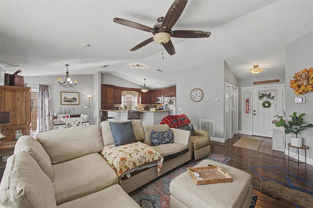 1632 Pintail Court Lutz, FL 33549 - Photo 5 of 34 a living room with furniture and a wooden floor