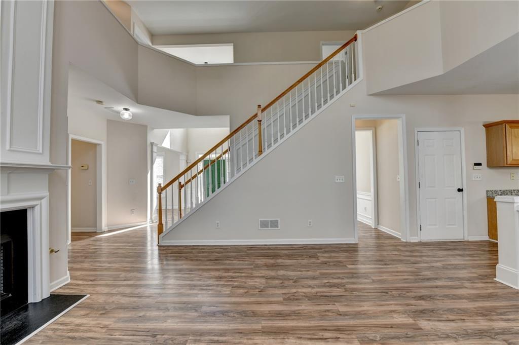 100 Hawnley Trc Northwest Suwanee, GA 30024 - Photo 19 of 58 a view of entryway and hall with wooden floor