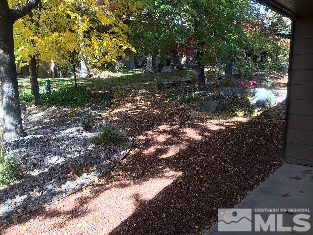 2929 Tierra Verde East Reno, NV 89512 - Photo 2 of 10 a backyard of a house with lots of green space