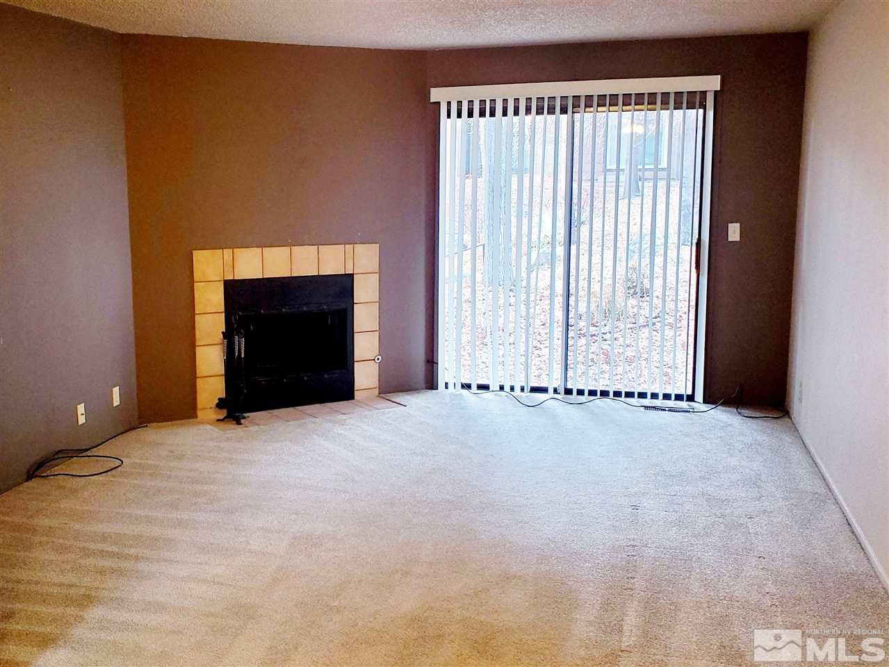 2929 Tierra Verde East Reno, NV 89512 - Photo 6 of 10 a view of an empty room with a fireplace