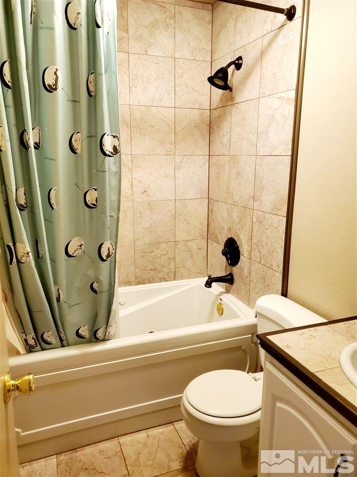 2929 Tierra Verde East Reno, NV 89512 - Photo 9 of 10 a bathroom with a bathtub and a toilet