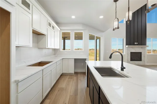 a kitchen with stainless steel appliances granite countertop a sink and cabinets