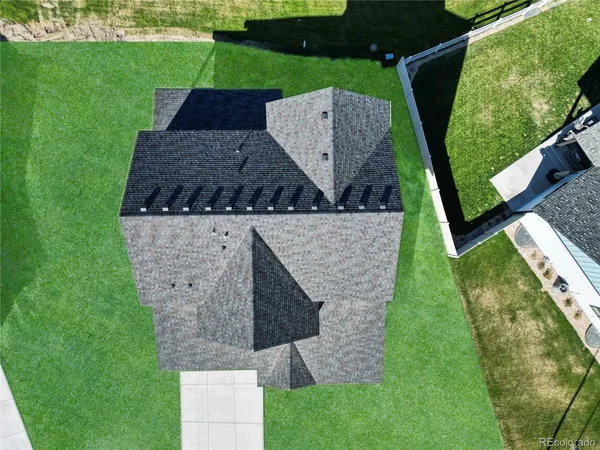 an aerial view of a house having yard