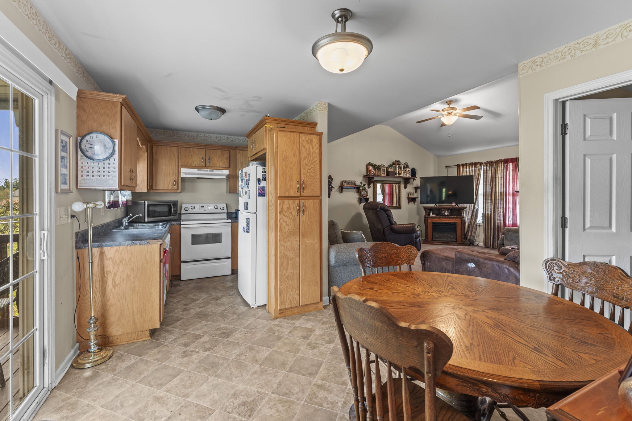159 Apple Drive Winchester, TN 37398 - Photo 17 of 32 a kitchen with stainless steel appliances granite countertop a refrigerator a stove top oven a sink dishwasher and white cabinets