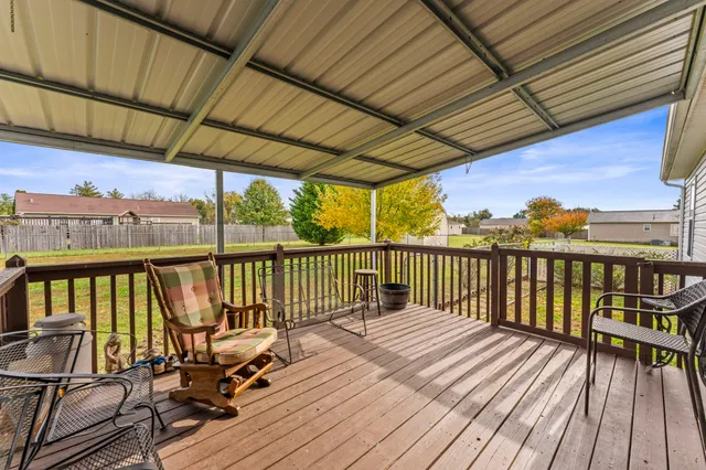 a view of balcony with wooden floor