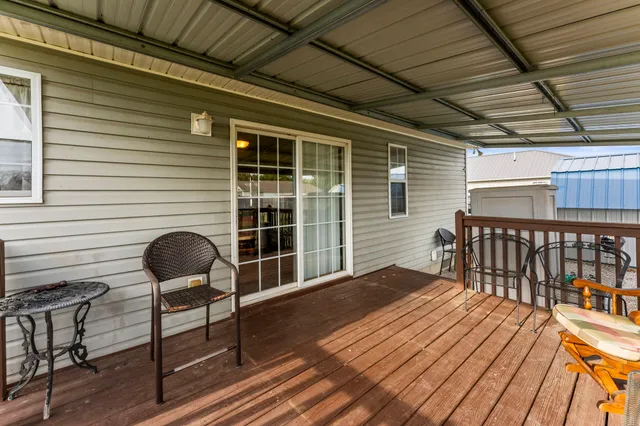 a balcony view with a seating space