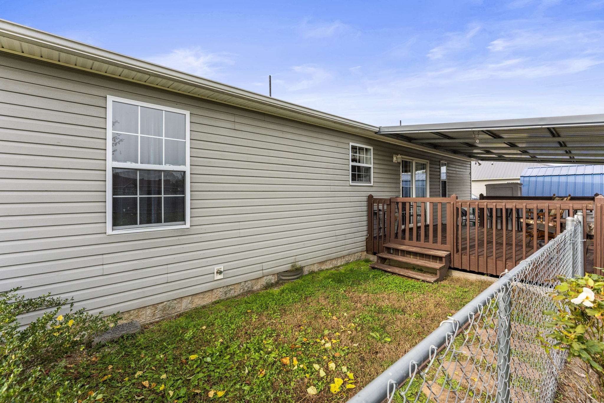 159 Apple Drive Winchester, TN 37398 - Photo 30 of 32 a view of a house with wooden deck and a yard