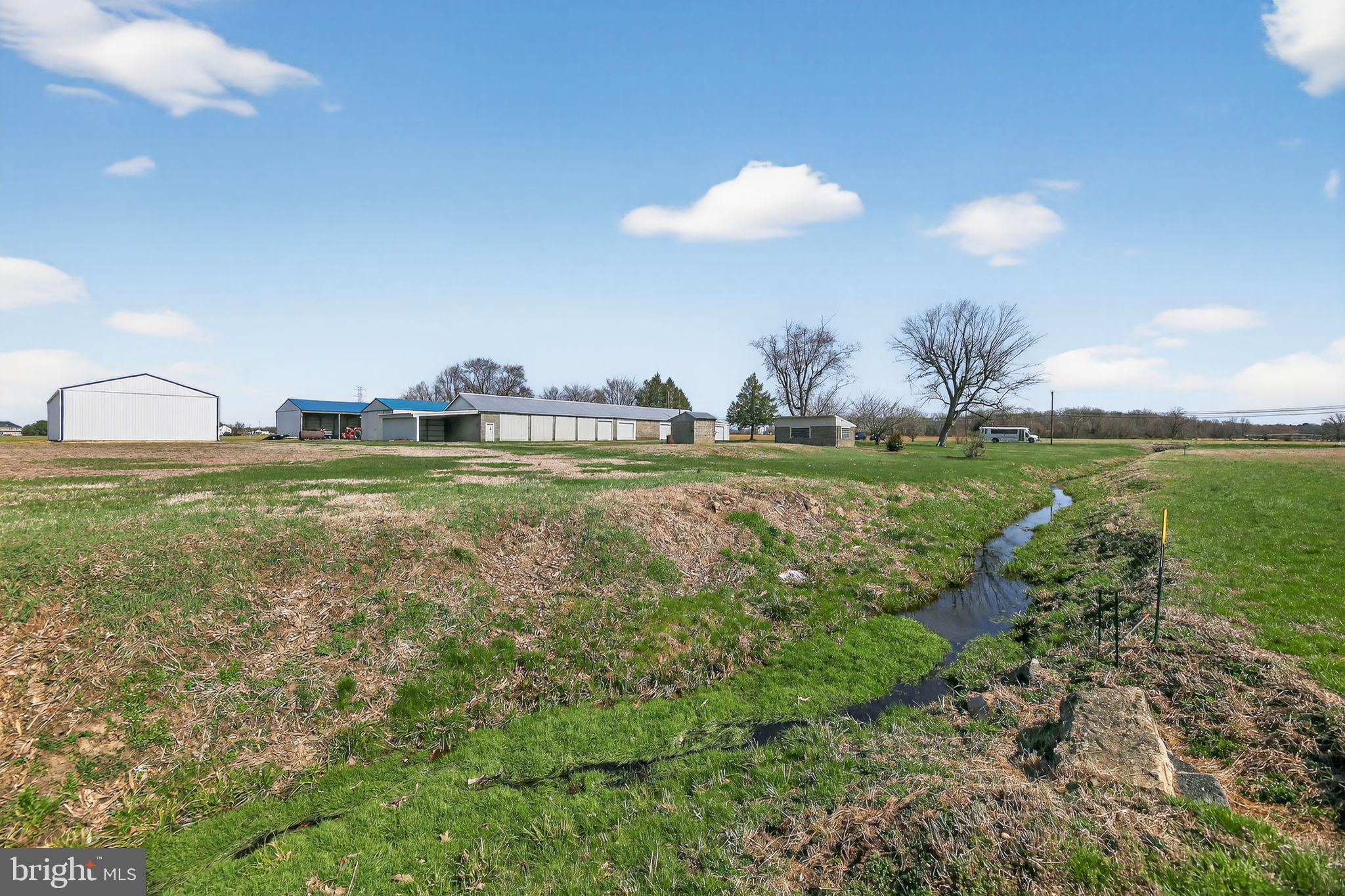 305 Wolfert Station Road Mullica Hill, NJ 08062 - Photo 11 of 15 a view of a golf course with a lake