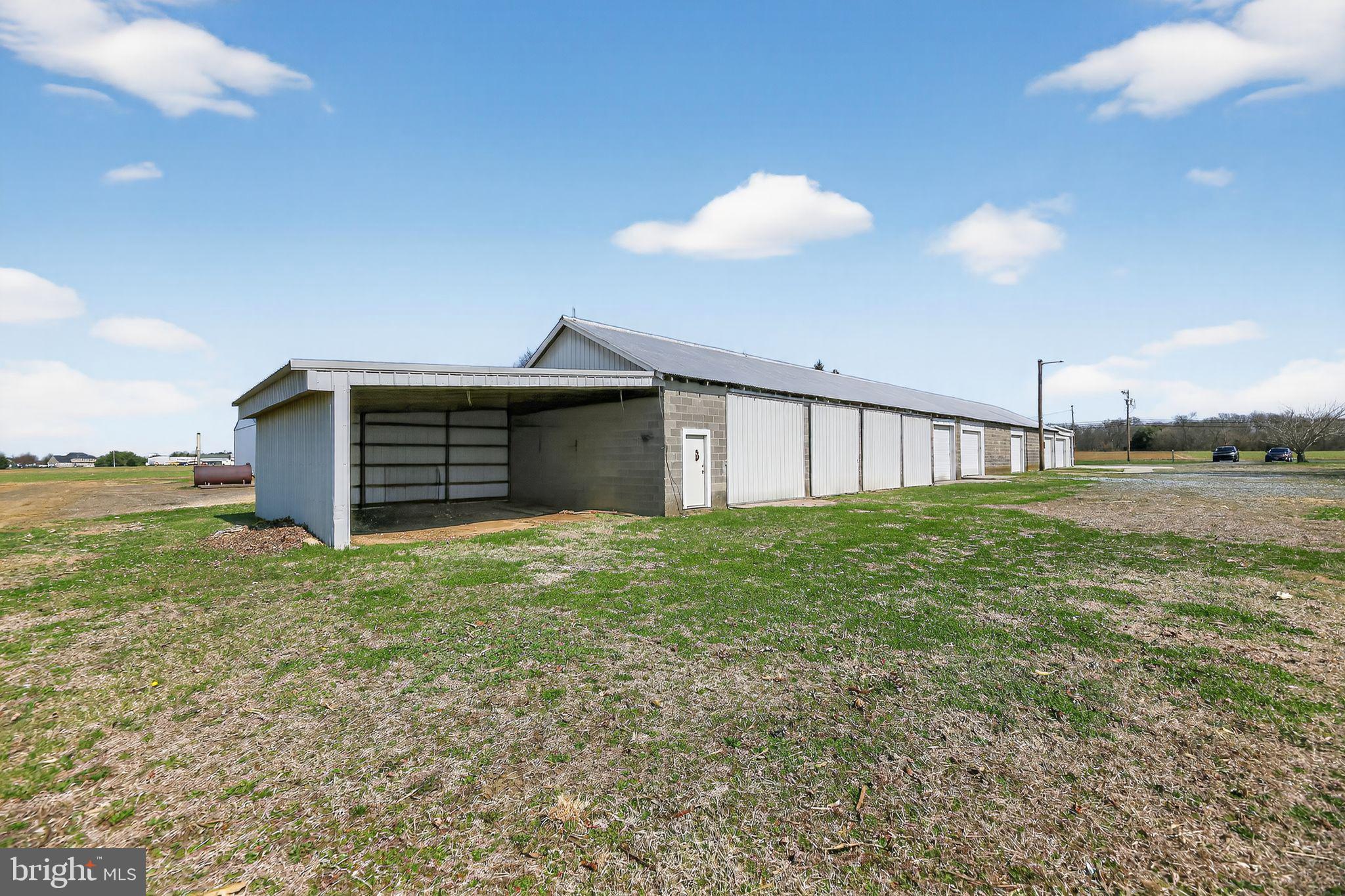 305 Wolfert Station Road Mullica Hill, NJ 08062 - Photo 4 of 15 a view of a backyard with plants and a garden