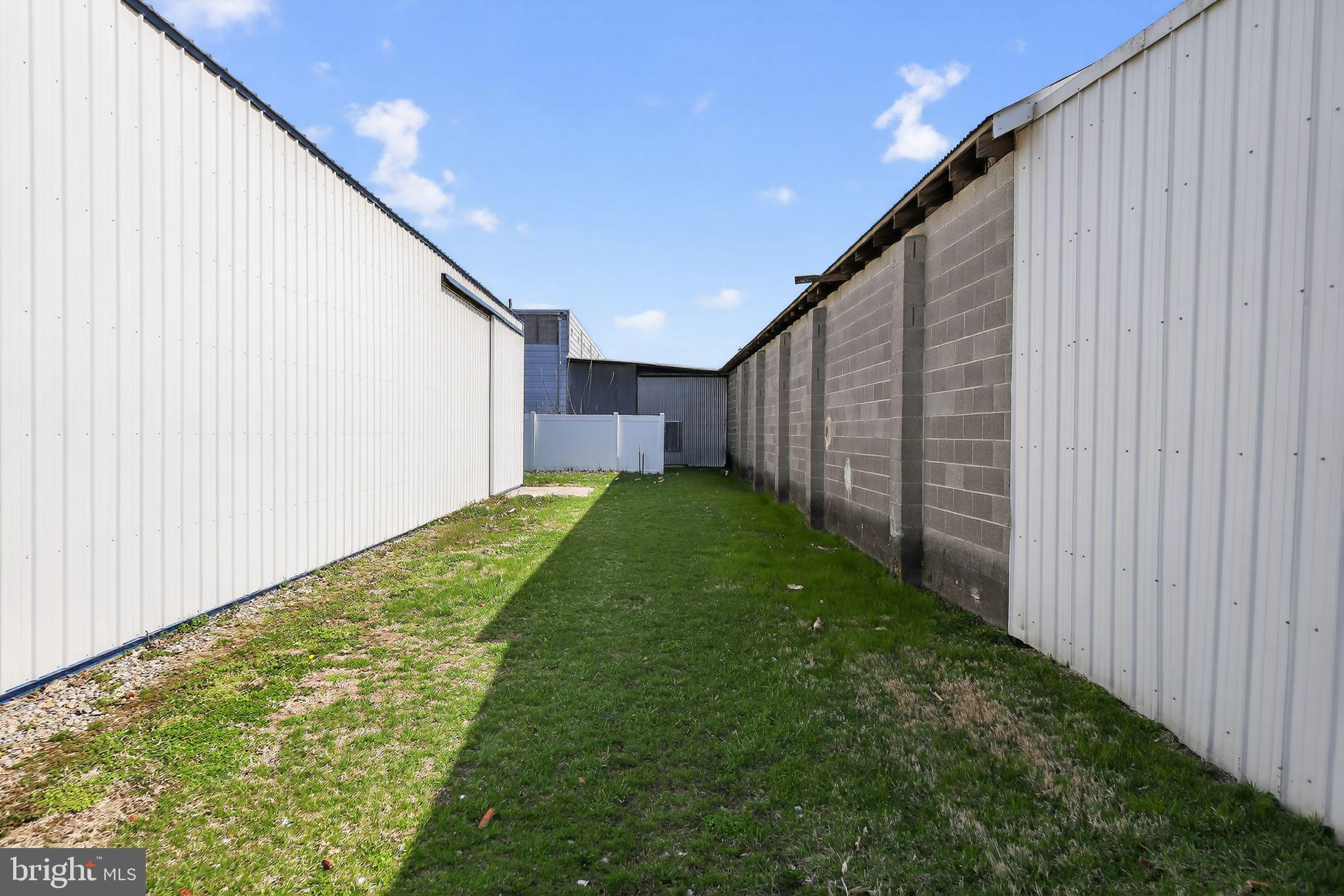 305 Wolfert Station Road Mullica Hill, NJ 08062 - Photo 9 of 15 a view of a backyard with wooden fence