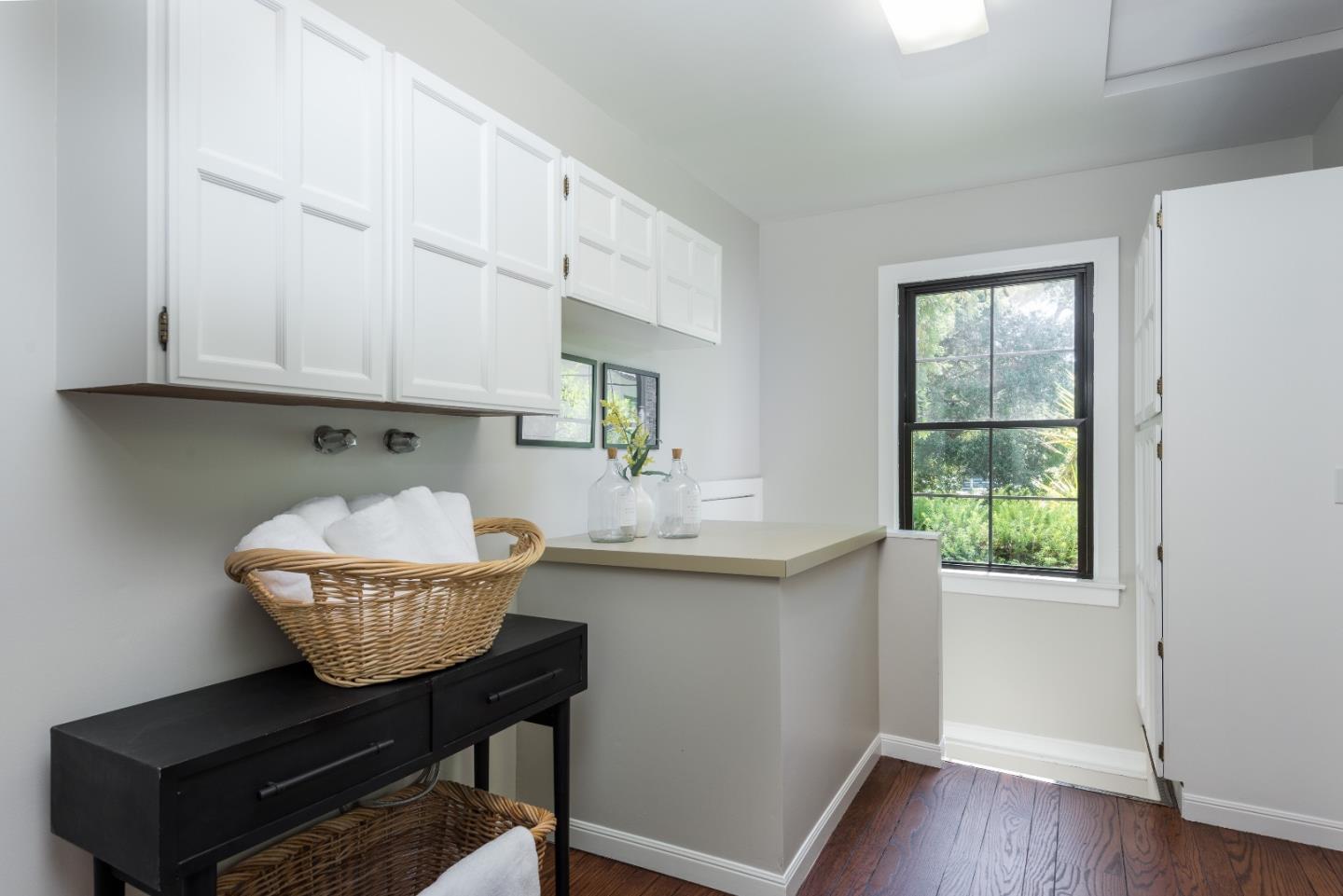 53 Lloyden Drive Atherton, CA 94027 - Photo 12 of 34 a kitchen with stainless steel appliances granite countertop a sink table and chairs