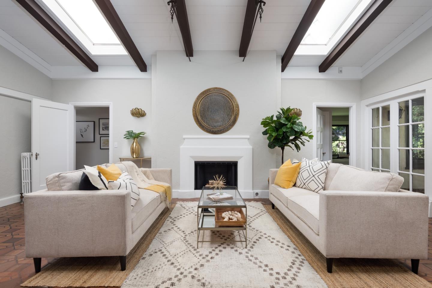 53 Lloyden Drive Atherton, CA 94027 - Photo 16 of 34 a living room with furniture and a fireplace