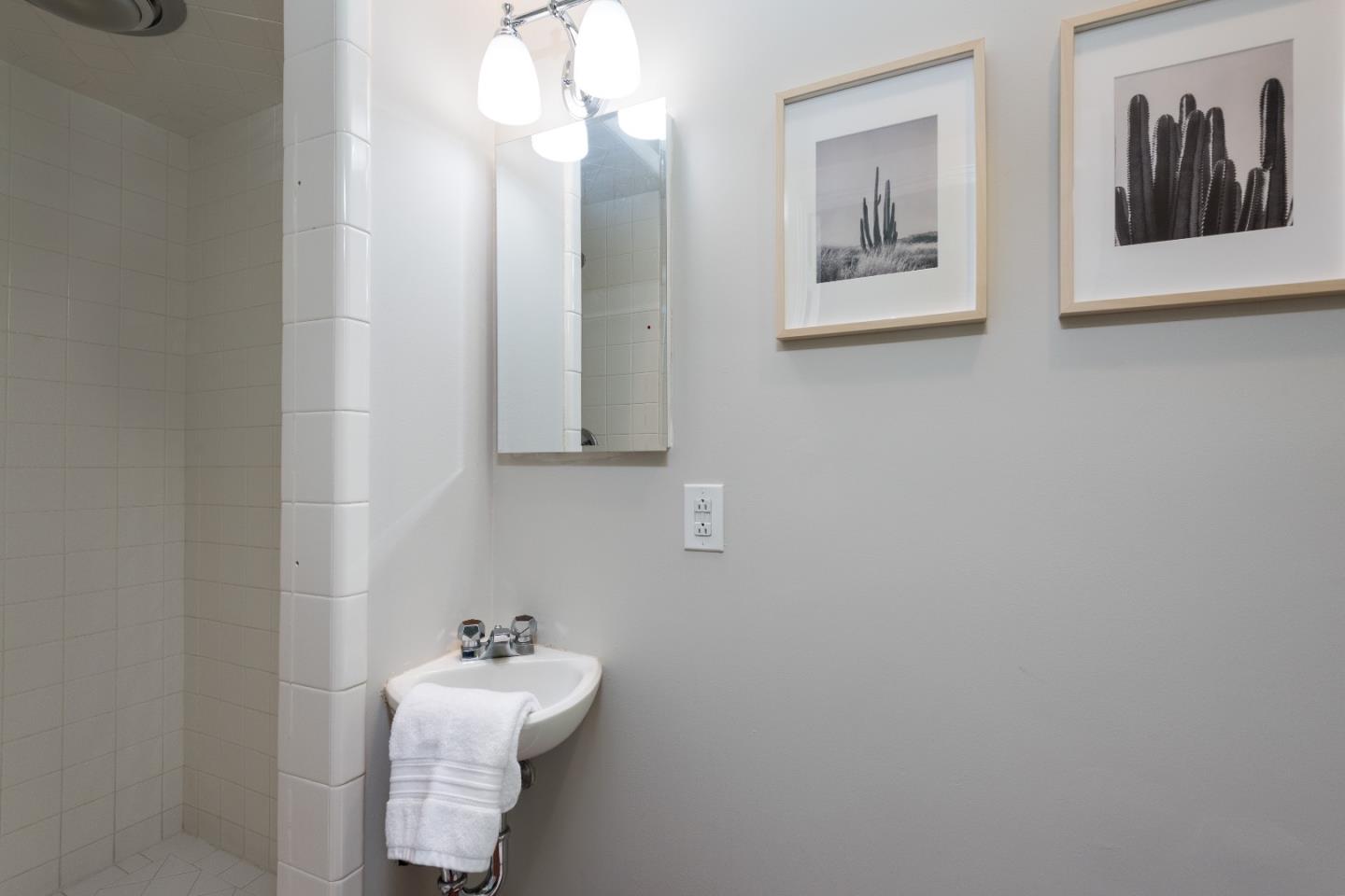 53 Lloyden Drive Atherton, CA 94027 - Photo 19 of 34 a bathroom with a sink and a mirror