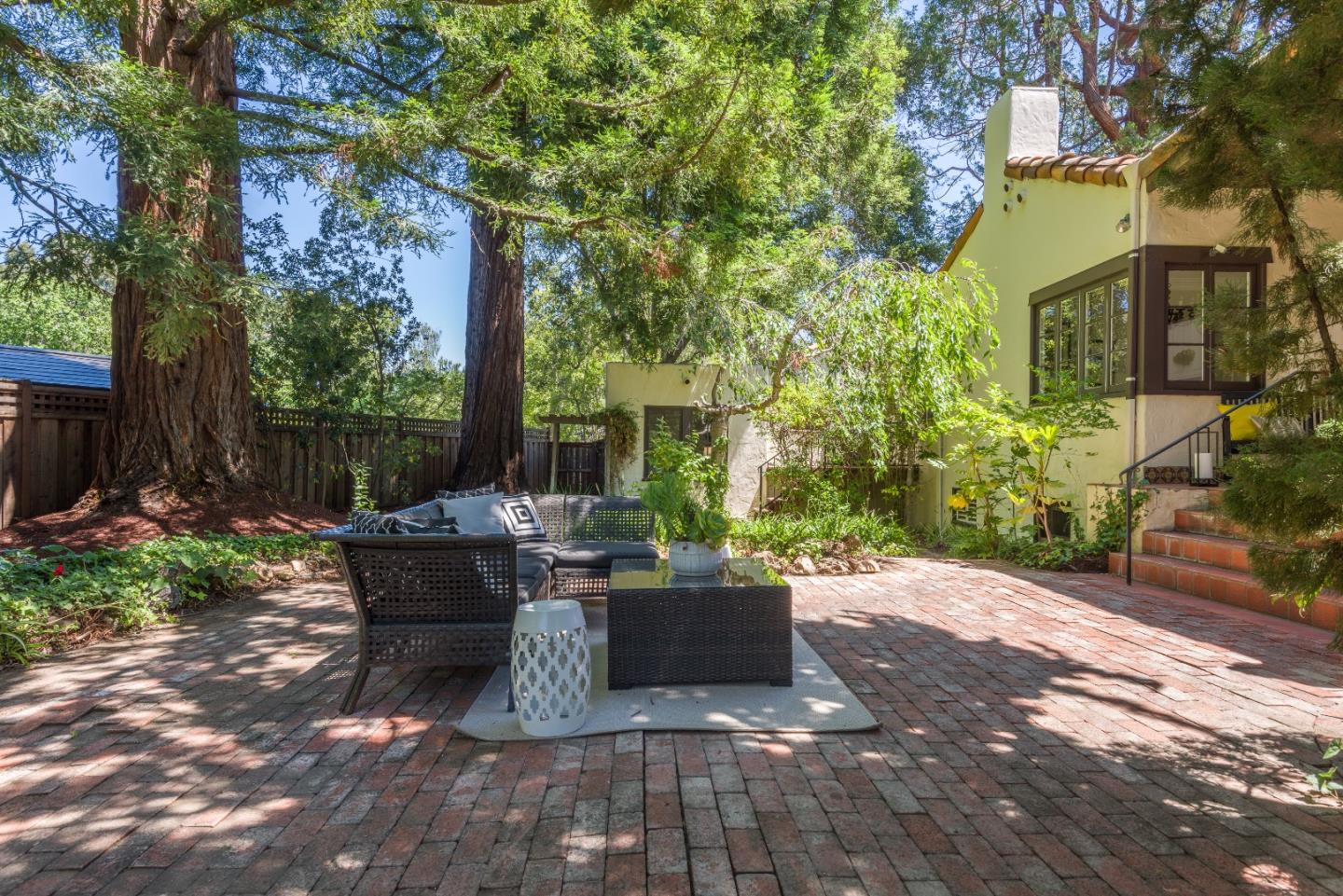 53 Lloyden Drive Atherton, CA 94027 - Photo 26 of 34 a view of a patio with table and chairs potted plants and large tree