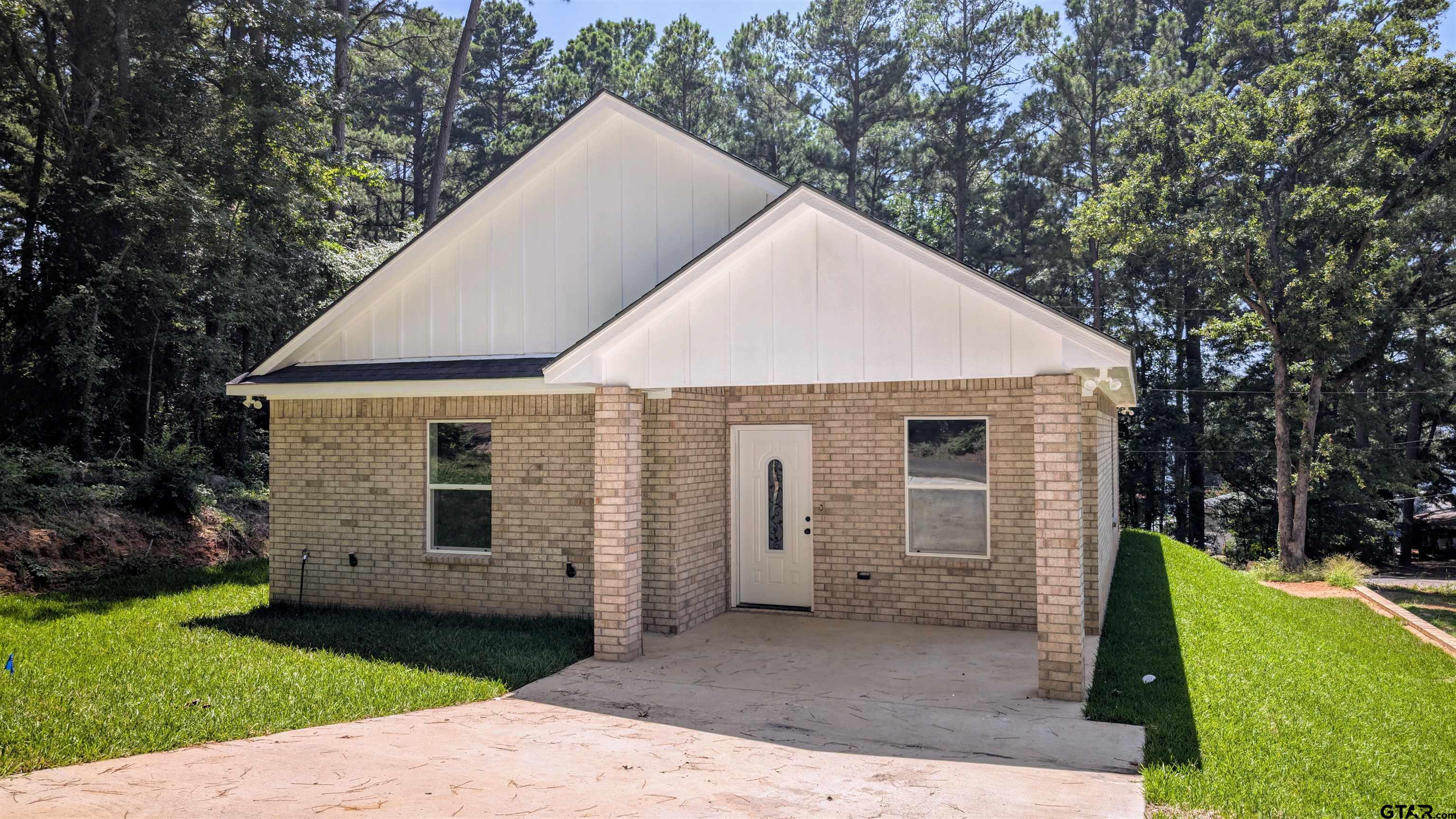 20428 High Point Drive Flint, TX 75762 - Photo 16 of 18 a view of a house with a yard