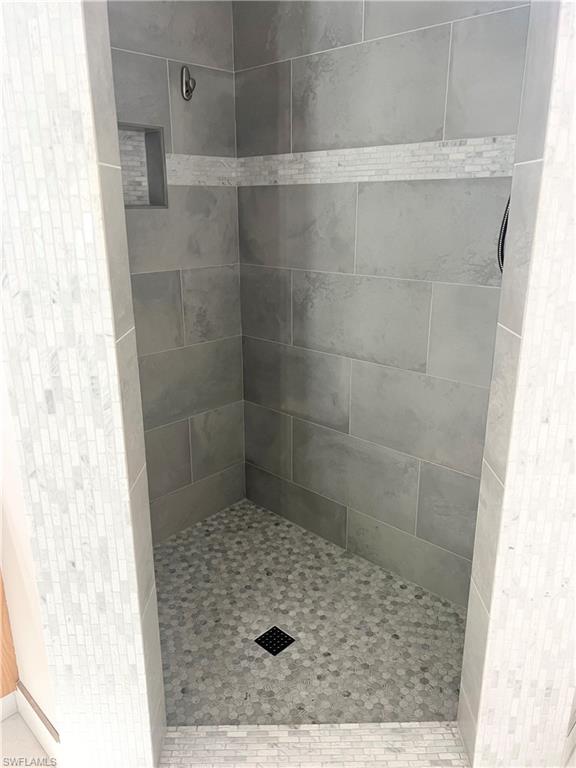 3221 64th Street Southwest Naples, FL 34105 - Photo 2 of 12 Bathroom featuring large tile shower